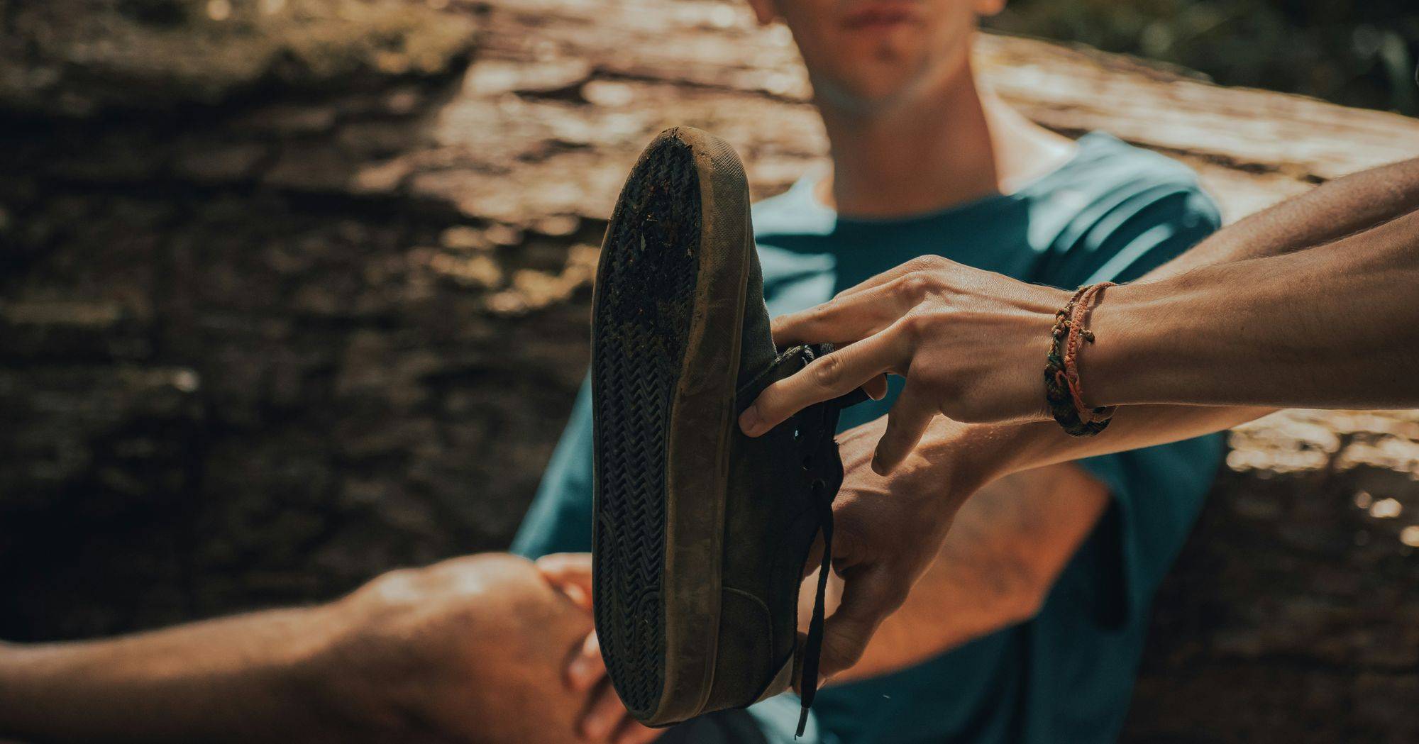 A fitter holding a pair of running shoes